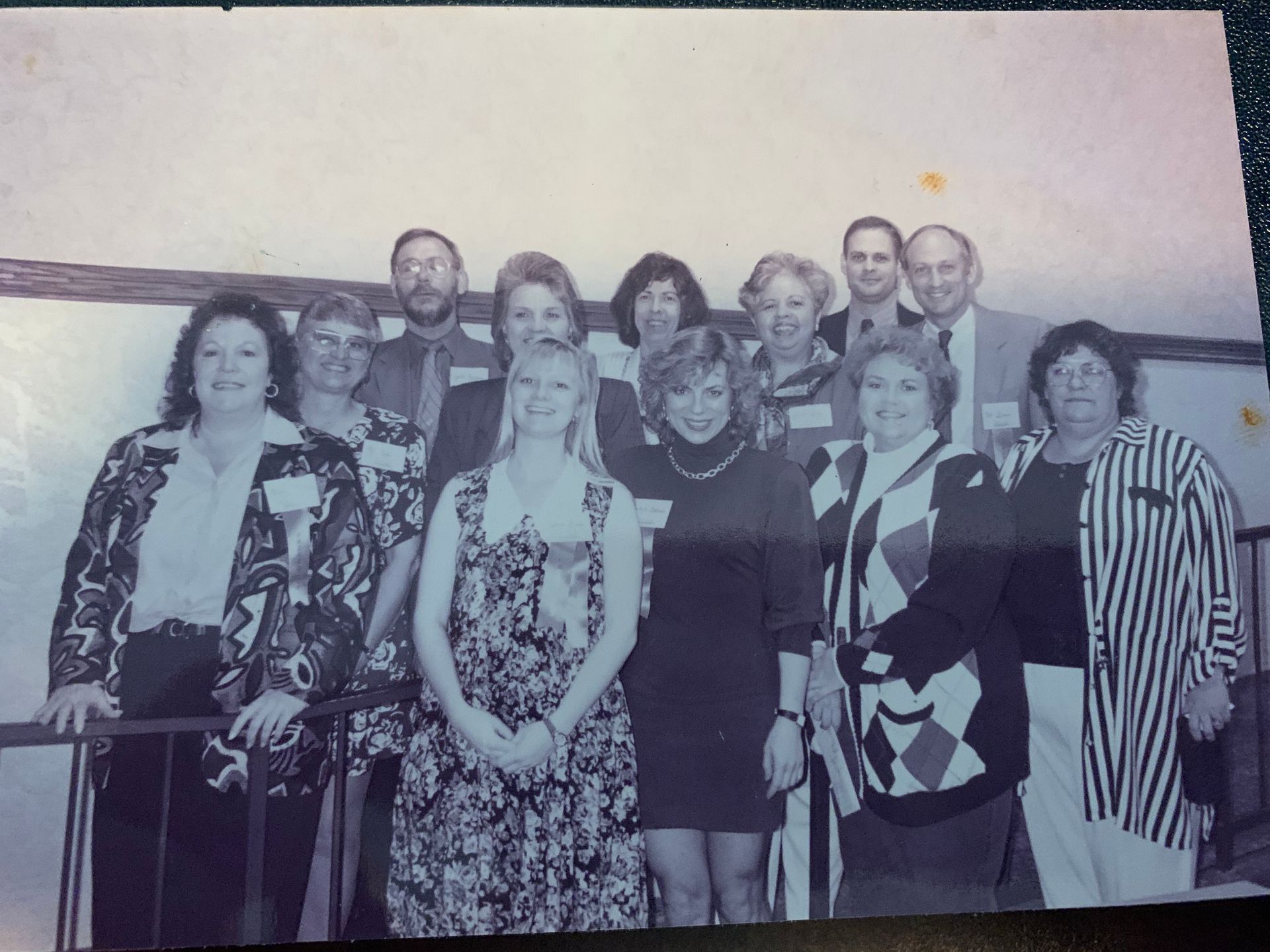 A black and white photo of a group of people posing for a picture