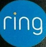 A blue ring logo is on a black surface. — Erie, PA — Peterson’s Property Maintenance A blue ring logo is on a black surface.