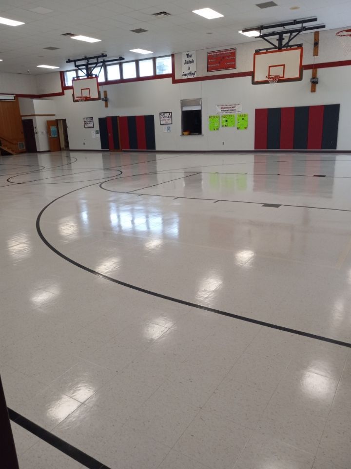 Man Mopping Gym Flooring — Erie, PA — Peterson’s Property Maintenance