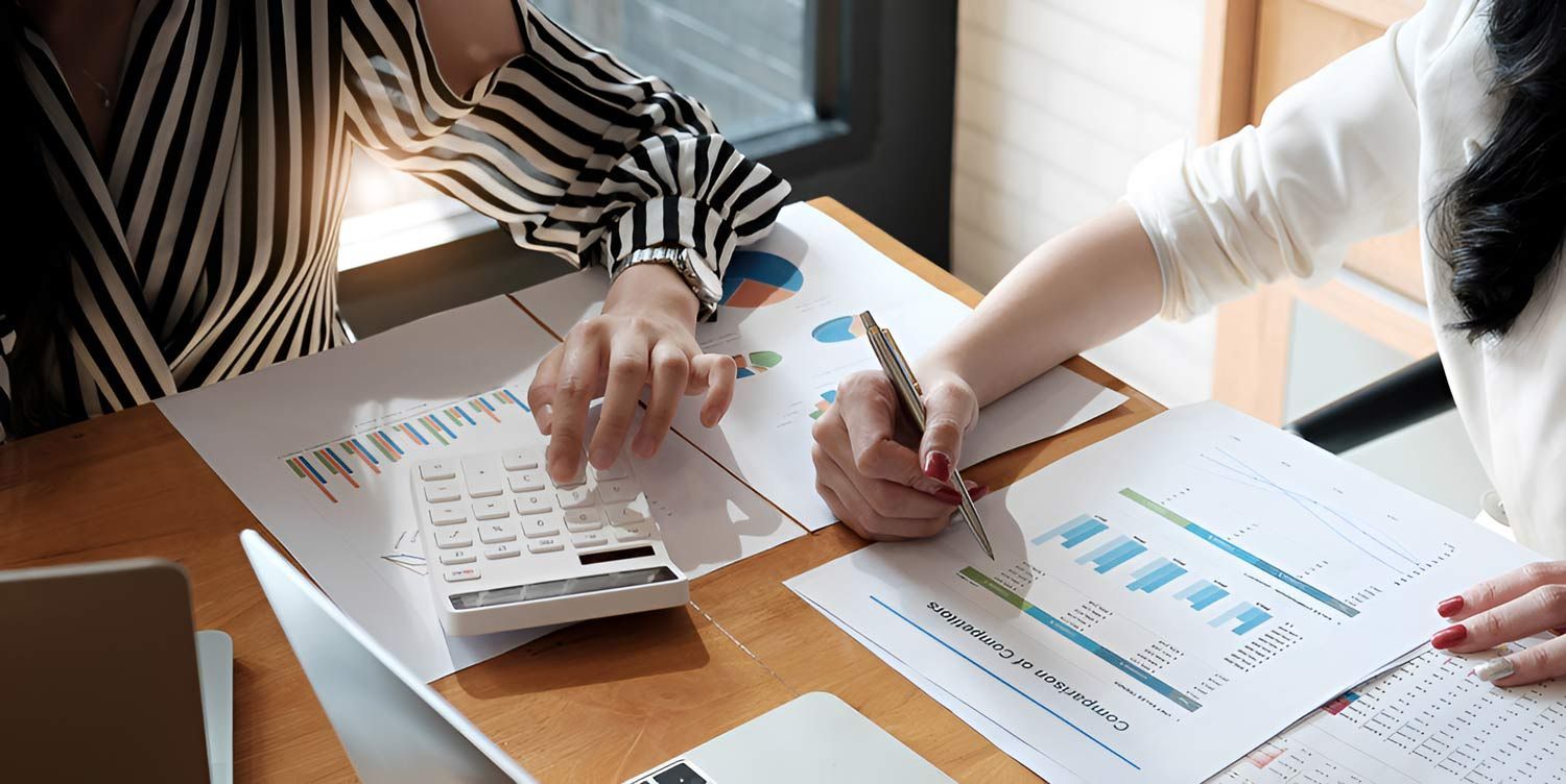 Business Advisor Showing A Plan Of Investment To Clients — Whitson Dawson Accountants in Central Queensland