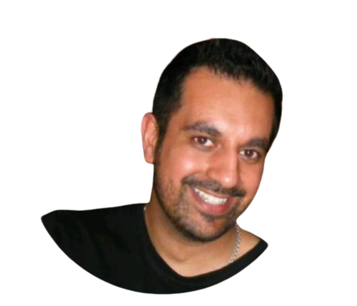 A man with a beard is smiling and wearing a black shirt