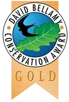 David Bellamy Conservation Award gold ribbon badge with leaf and bird logo