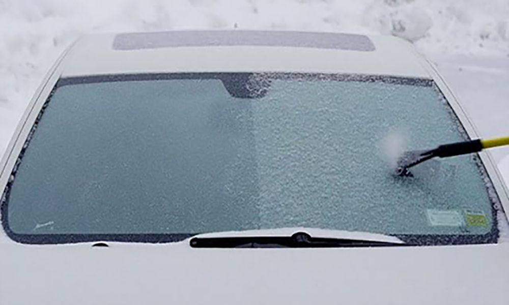car window covered in ice
