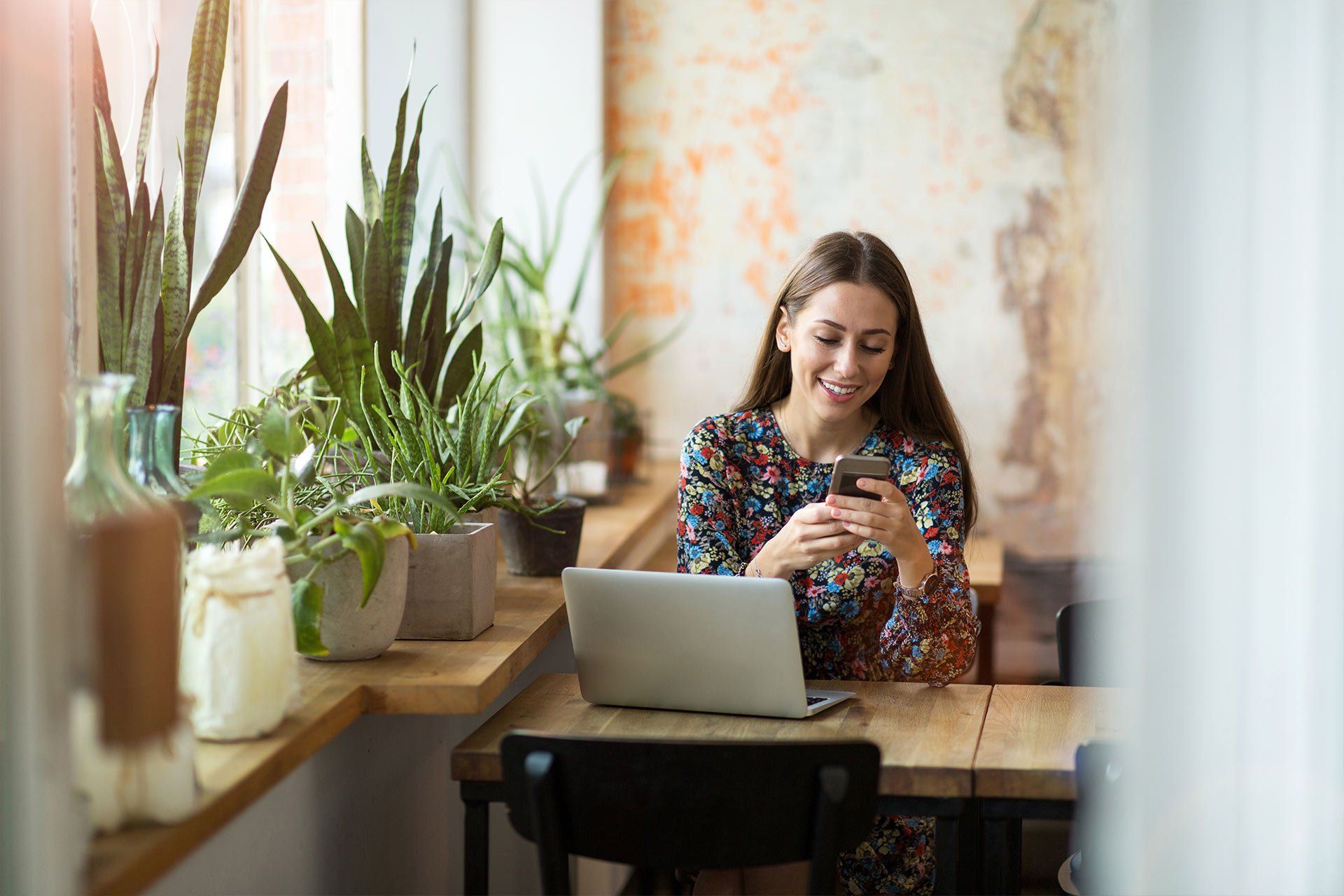 Woman sat in coffee shop working