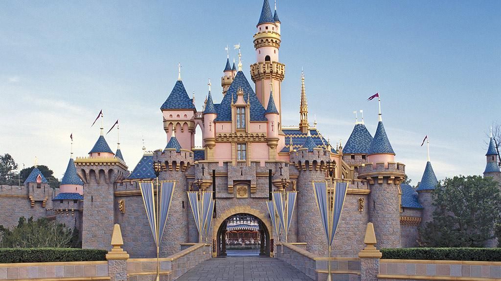 A large castle with a bridge leading to it