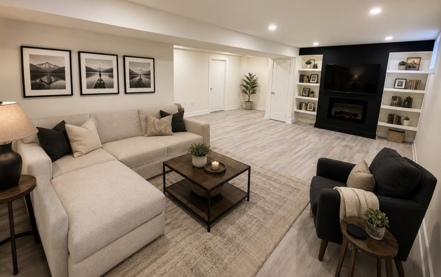 Bright living room with sectional sofa, armchair, coffee table, fireplace, and wall art