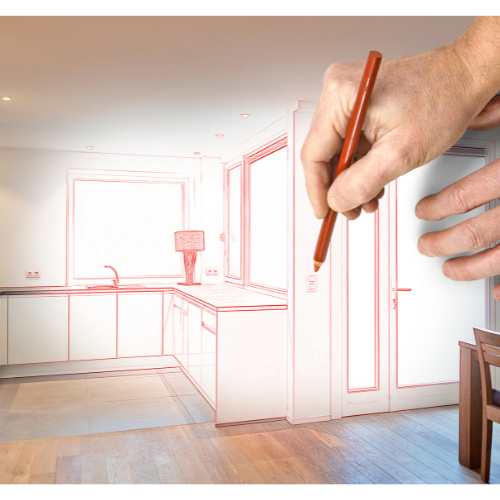 A person is drawing a kitchen with a pencil