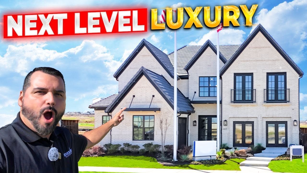 Man points at luxury home with