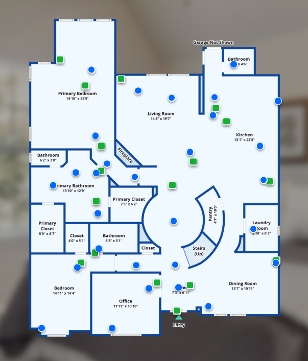 Floor plan of a house with labeled rooms and green/blue markers showing points of interest.