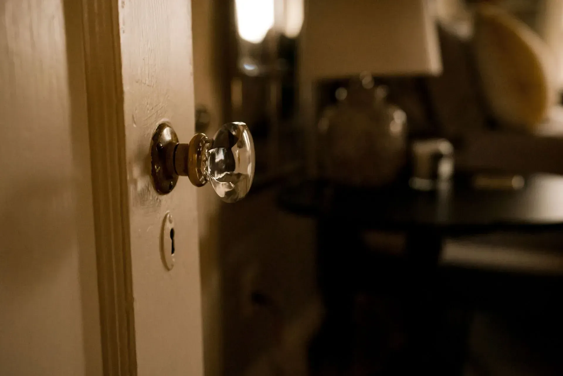 A close up of a door knob in a room