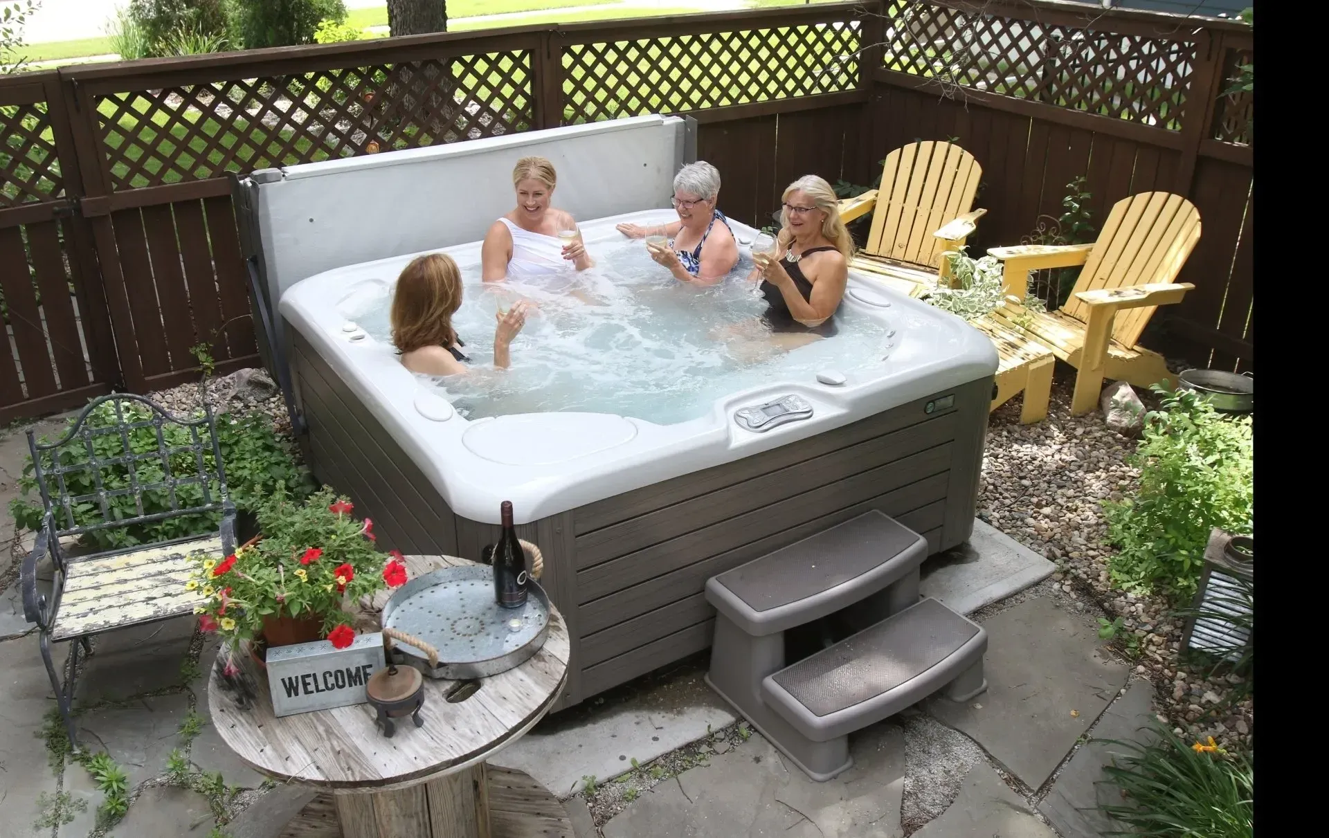 A group of women are sitting in a hot tub