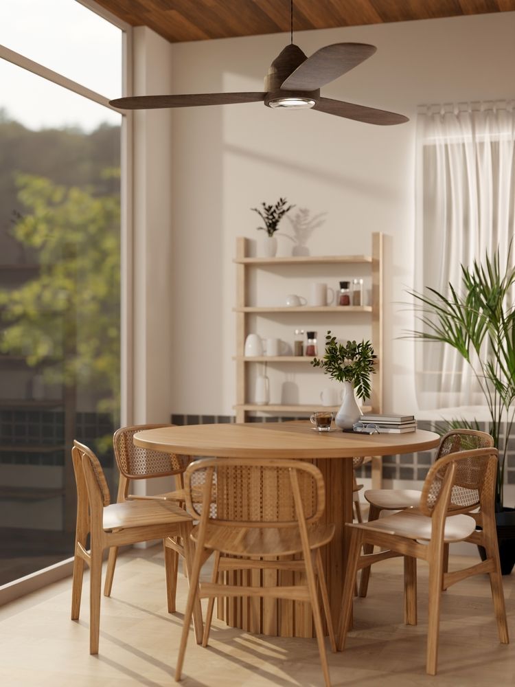 Dining room with round wooden table and chairs, shelf with decor, and a ceiling fan.