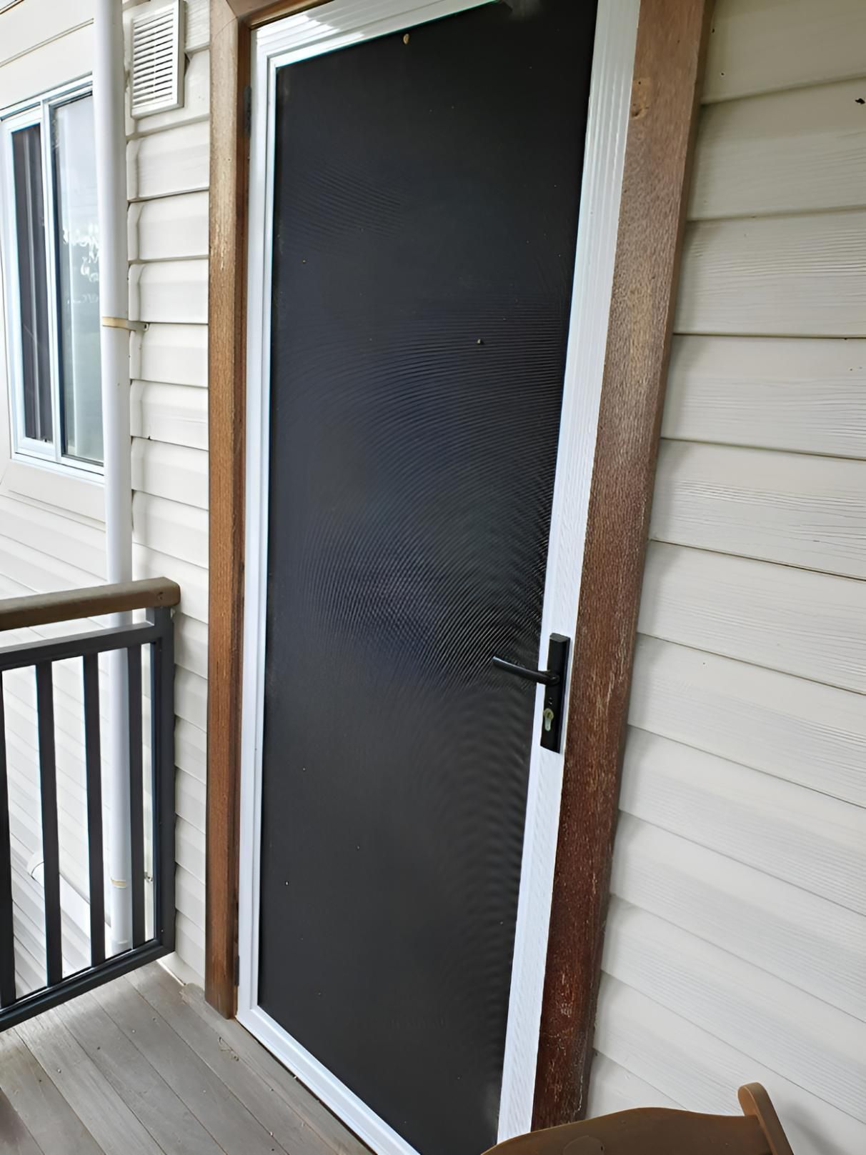 A Screen Door is Sitting on a Balcony Next to a Window — Hunter Valley Lattice in Newcastle, NSW
