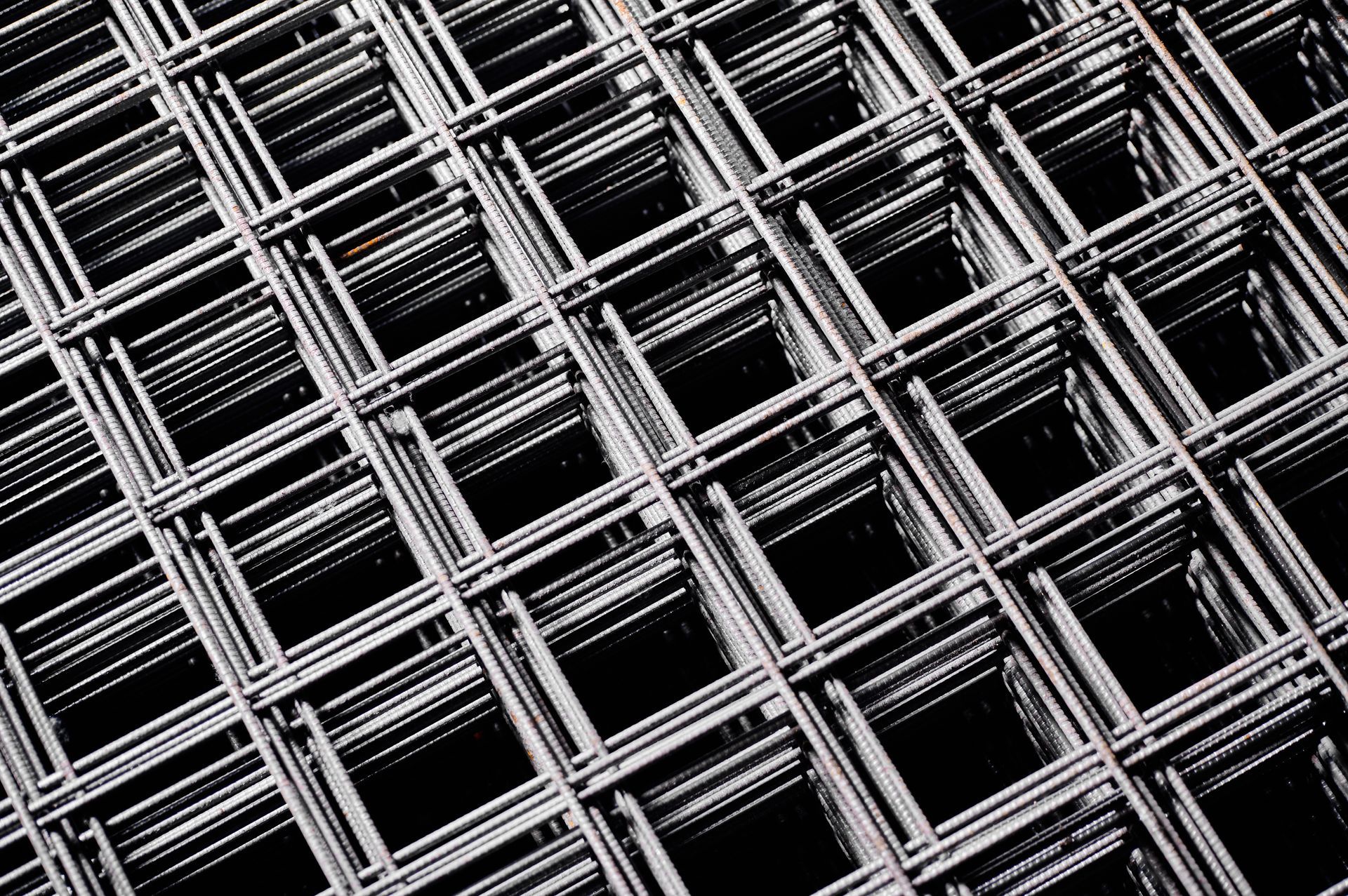 Close-up of stacked welded wire mesh in a cold plant storehouse. Close-up of stacked welded wire mesh in a cold plant storehouse.