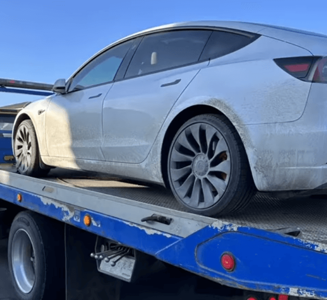 Towing company helps a car with flat tire in alhambra, CA