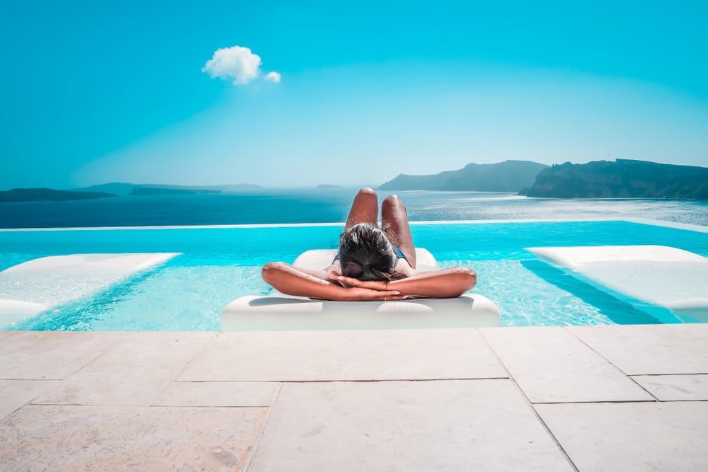 Woman Relaxing by the Pool — NQ Pool Supplies in Smithfield, QLD