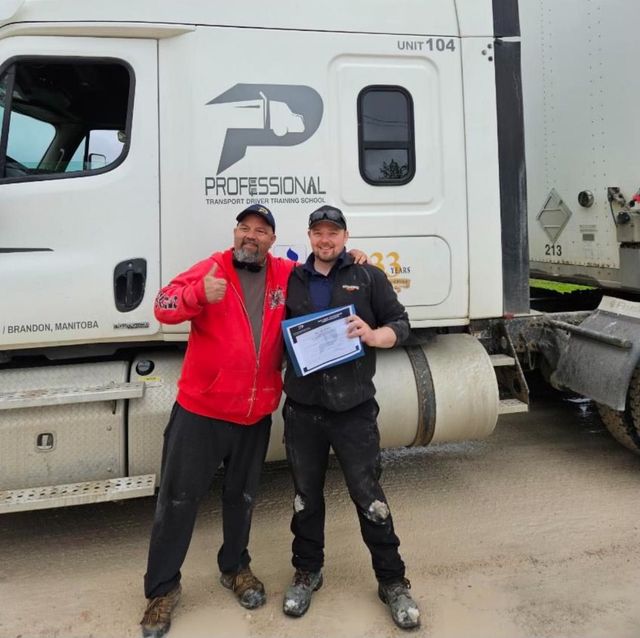 Two men standing in front of a professional truck