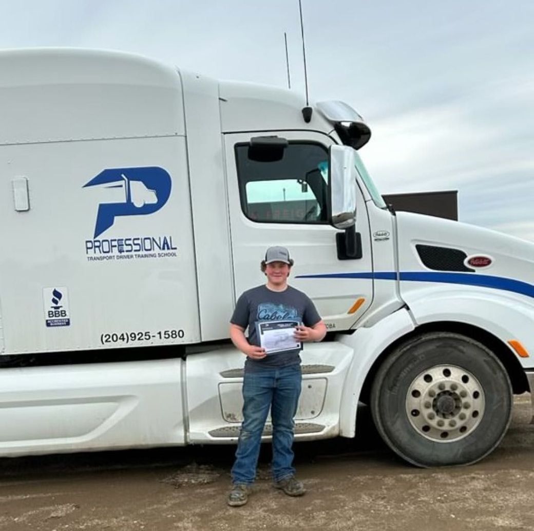 A man is standing in front of a professional semi truck