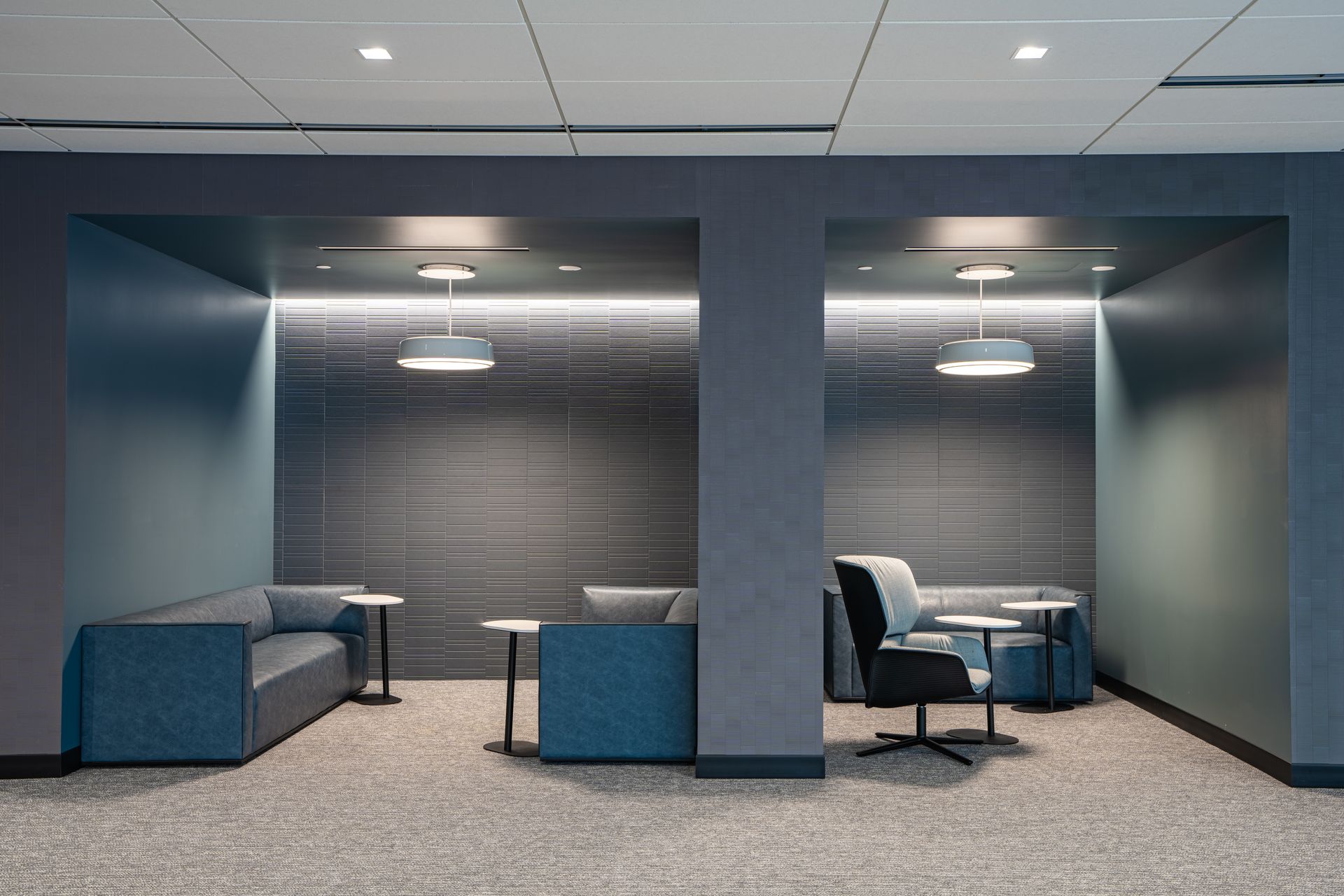 Meeting room with table, chairs, TV displaying 1:53 AM, and window.