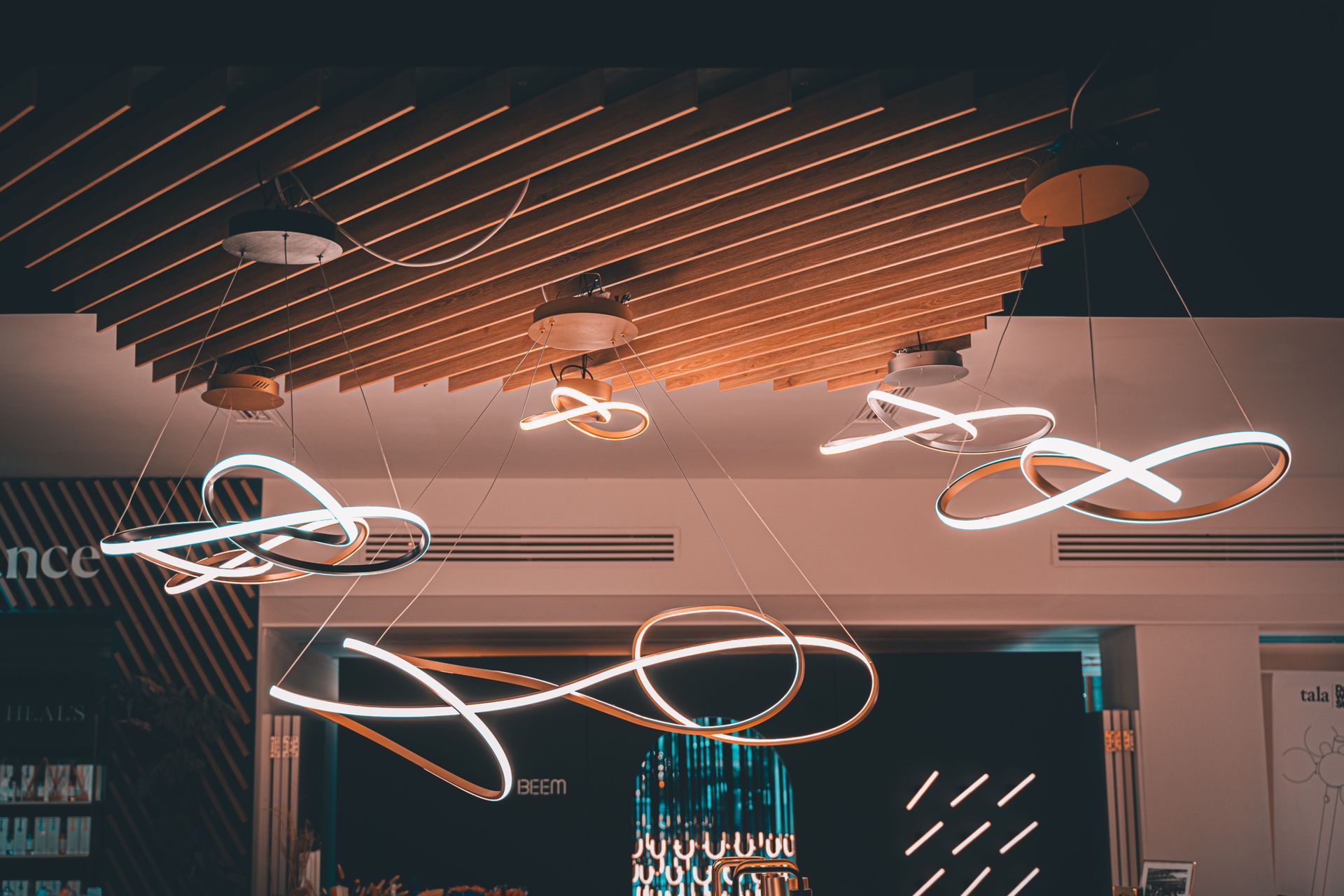 Modern ceiling with glowing circular pendant lights in a stylish interior