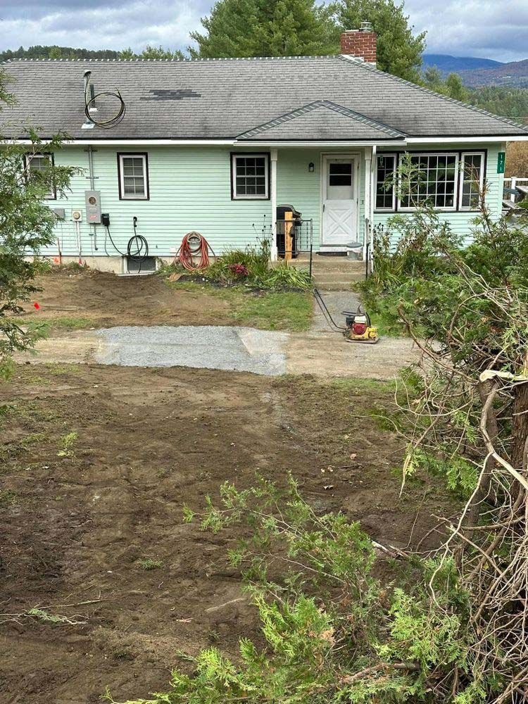 A house with a lot of dirt in front of it.