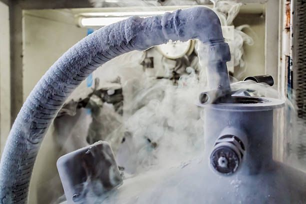 A close up of a hose with liquid nitrogen coming out of it.