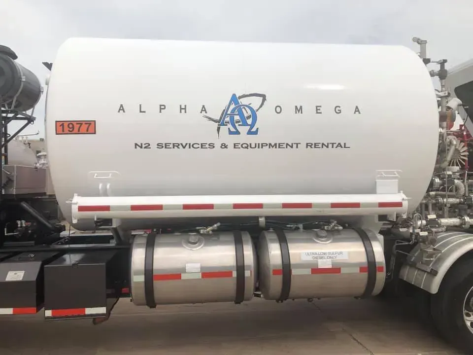 An alpha omega truck is parked in a parking lot An alpha omega truck is parked in a parking lot