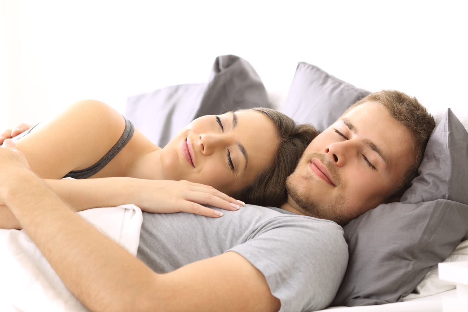 happy couple sleeping with the help of Inspire therapy