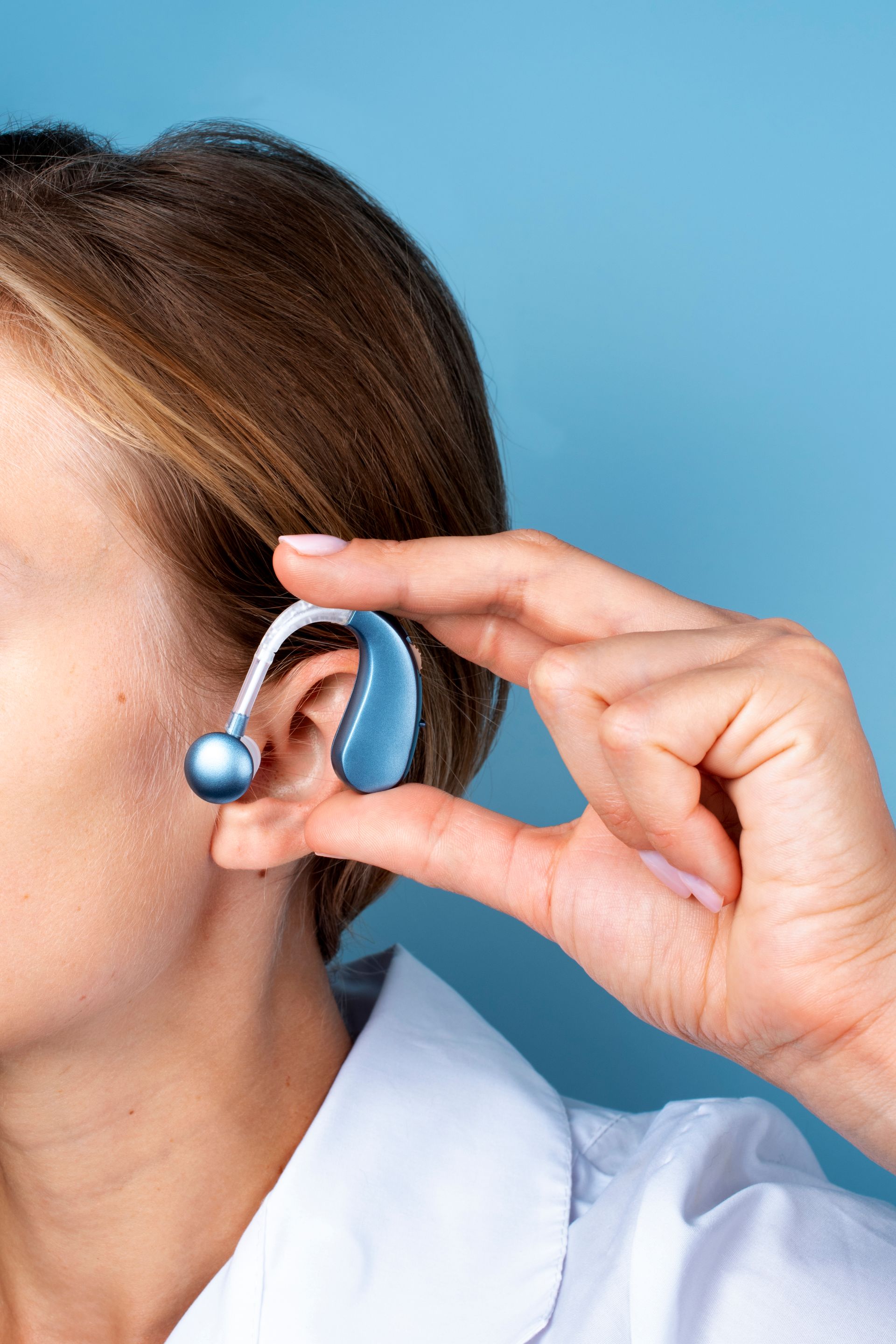side view of a woman wearing hearing aids