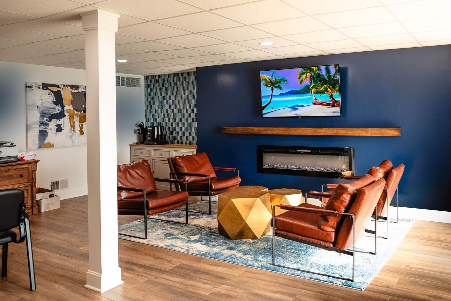 a living room with a fireplace and a television on the wall