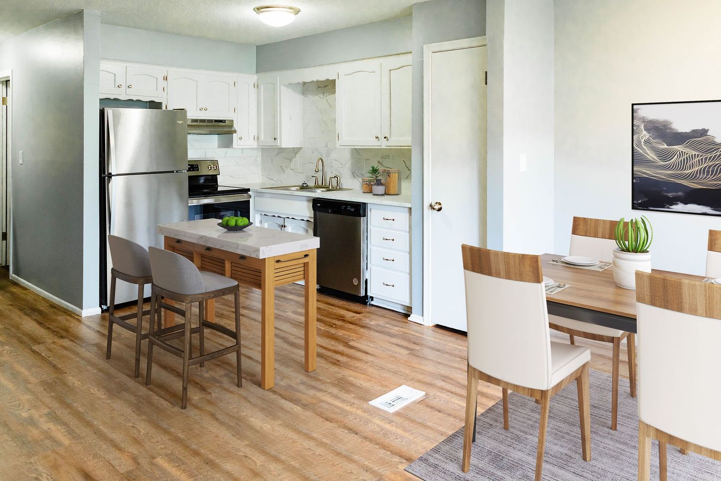 a kitchen with stainless steel appliances and white cabinets