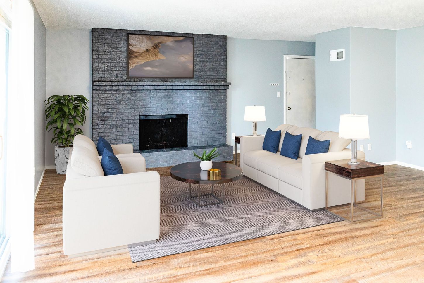 a living room with a fireplace and a couch