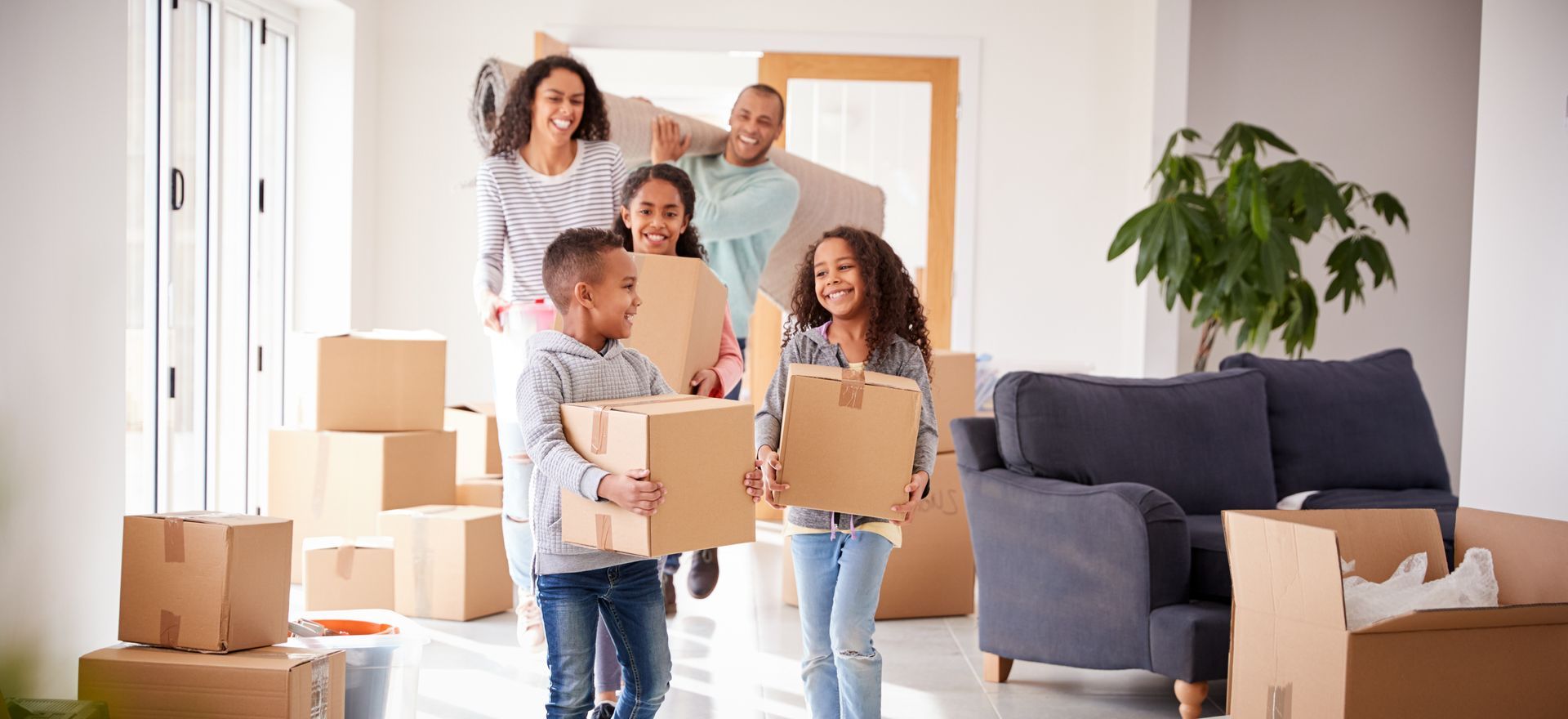 couple laughing with moving boxes