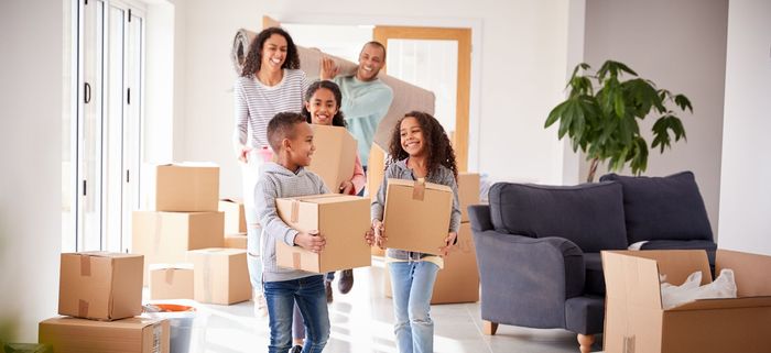 couple laughing with moving boxes