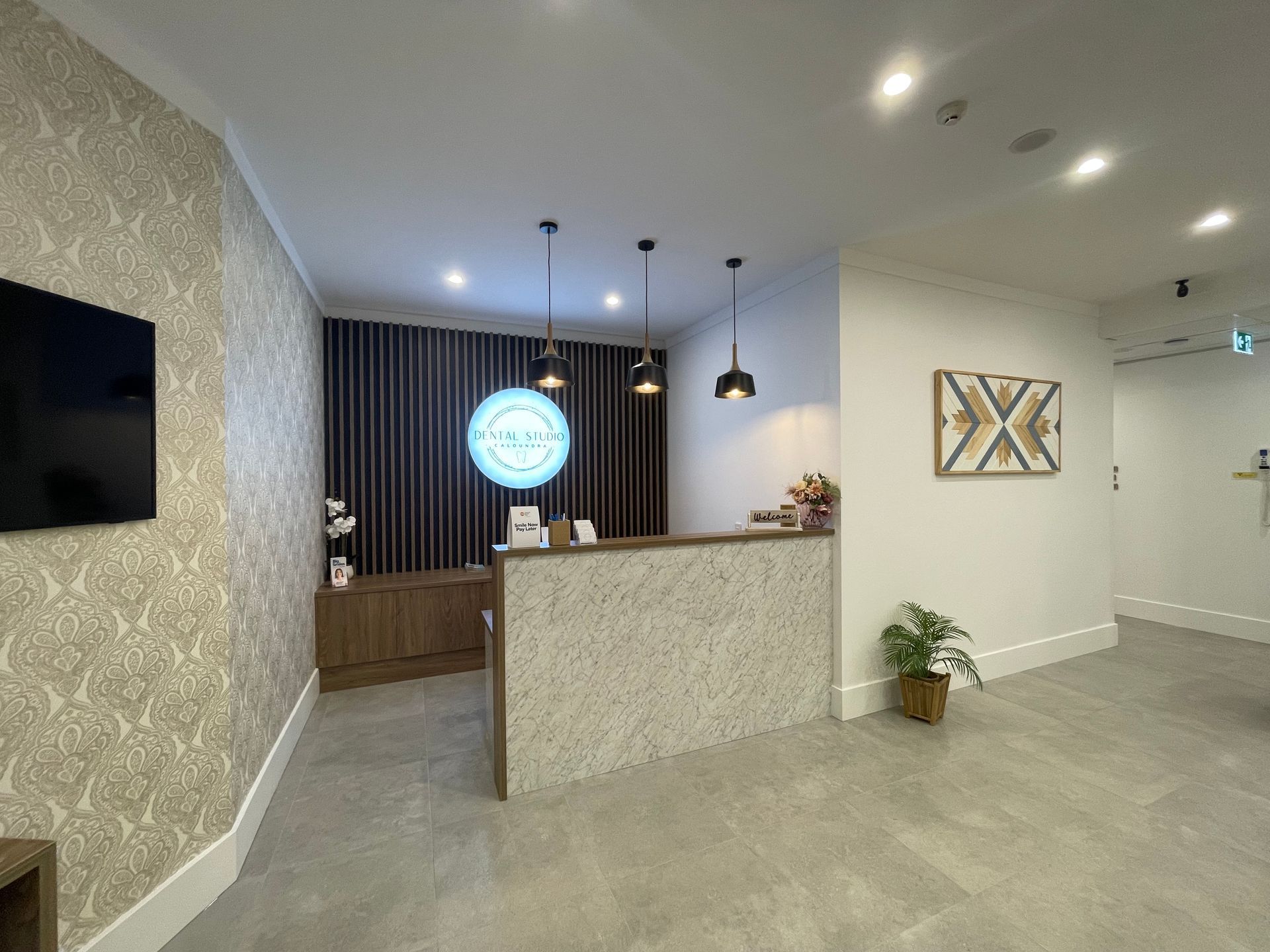 A Modern Reception Area Featuring a Patterned Stone Desk — Gray Projects in Woodford, QLD