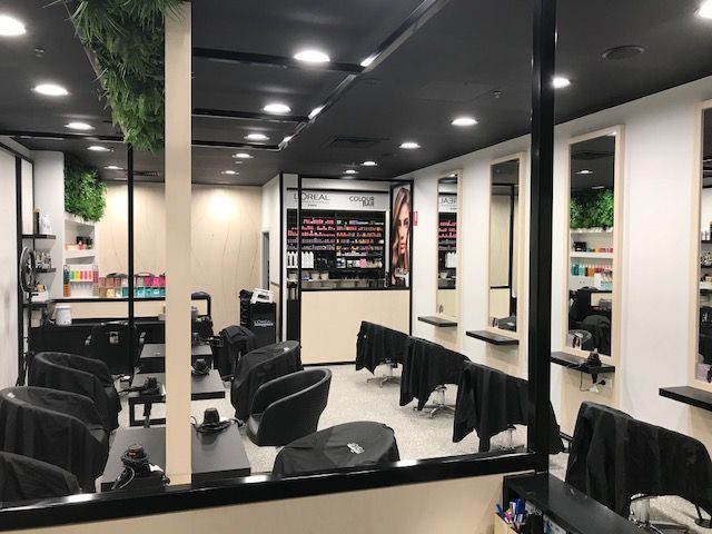 A Modern Hair Salon With Black Ceiling, White Walls — Gray Projects in Woodford, QLD