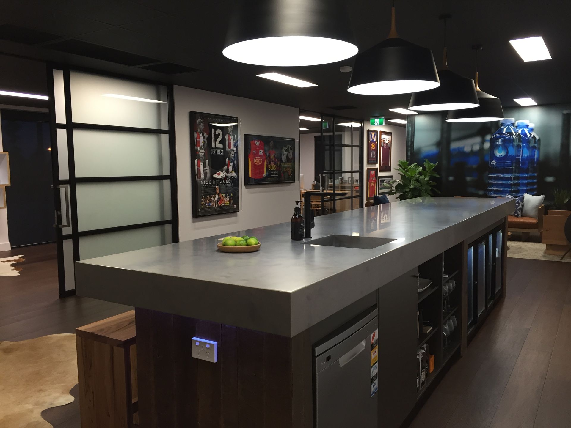 A Sleek, Modern Kitchen With a Large Gray Island — Gray Projects in Woodford, QLD