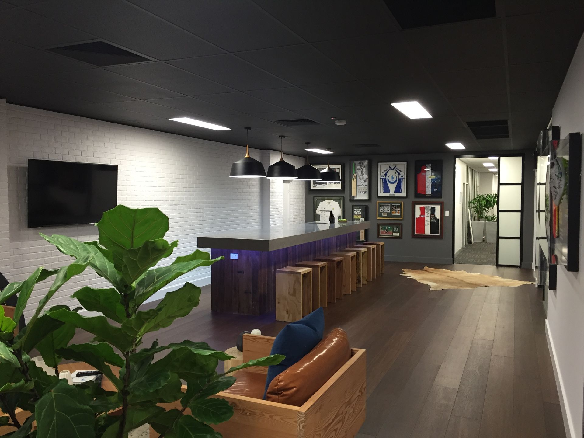 A Modern Office Lounge With a Long Bar — Gray Projects in Woodford, QLD