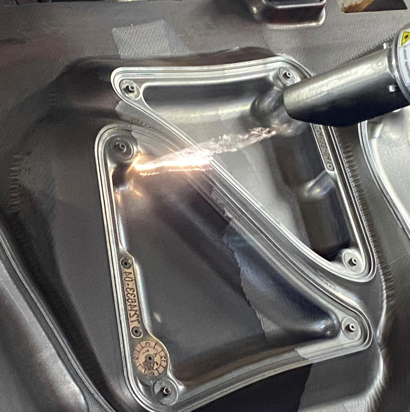 A close up of a metal object with a sticker that says ' aluminum ' on it