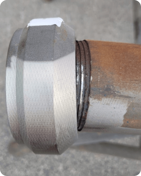 A close up of a metal pipe with a ring on it