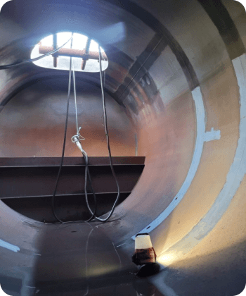 A large metal pipe with a hole in the middle
