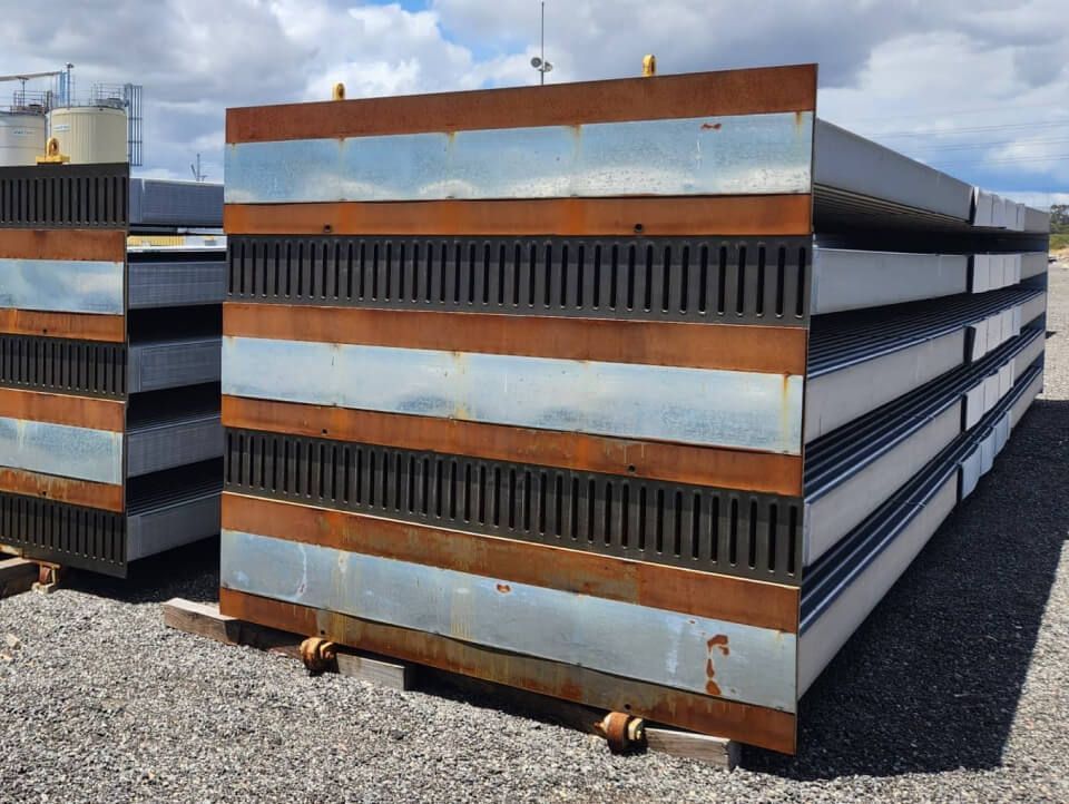 A bunch of metal boxes are stacked on top of each other