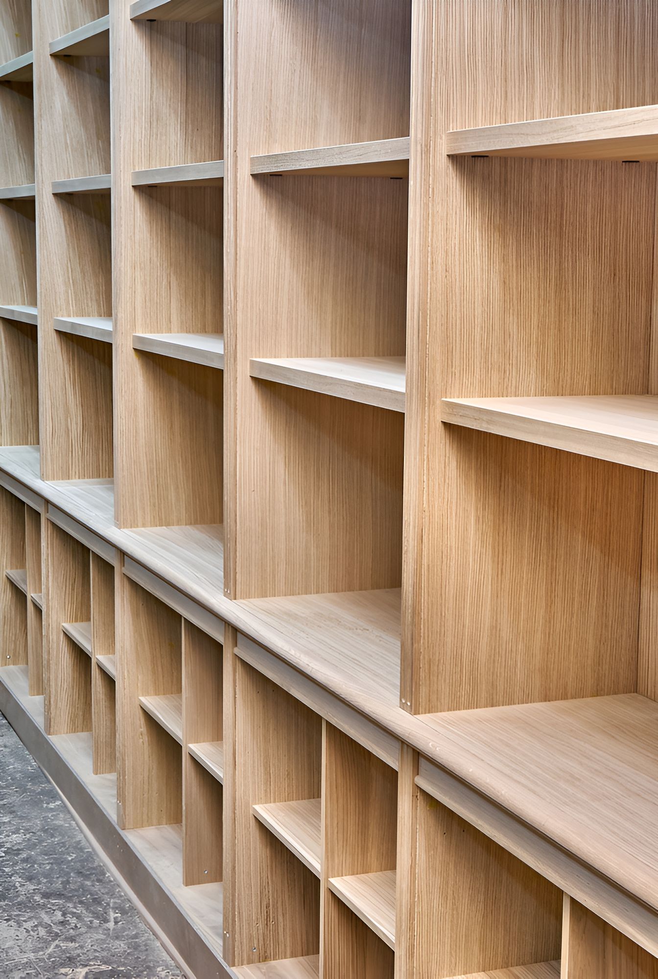 A wall of shelves made out of light coloured wood — Tefa Kitchens & Joinery in Maitland, NSW