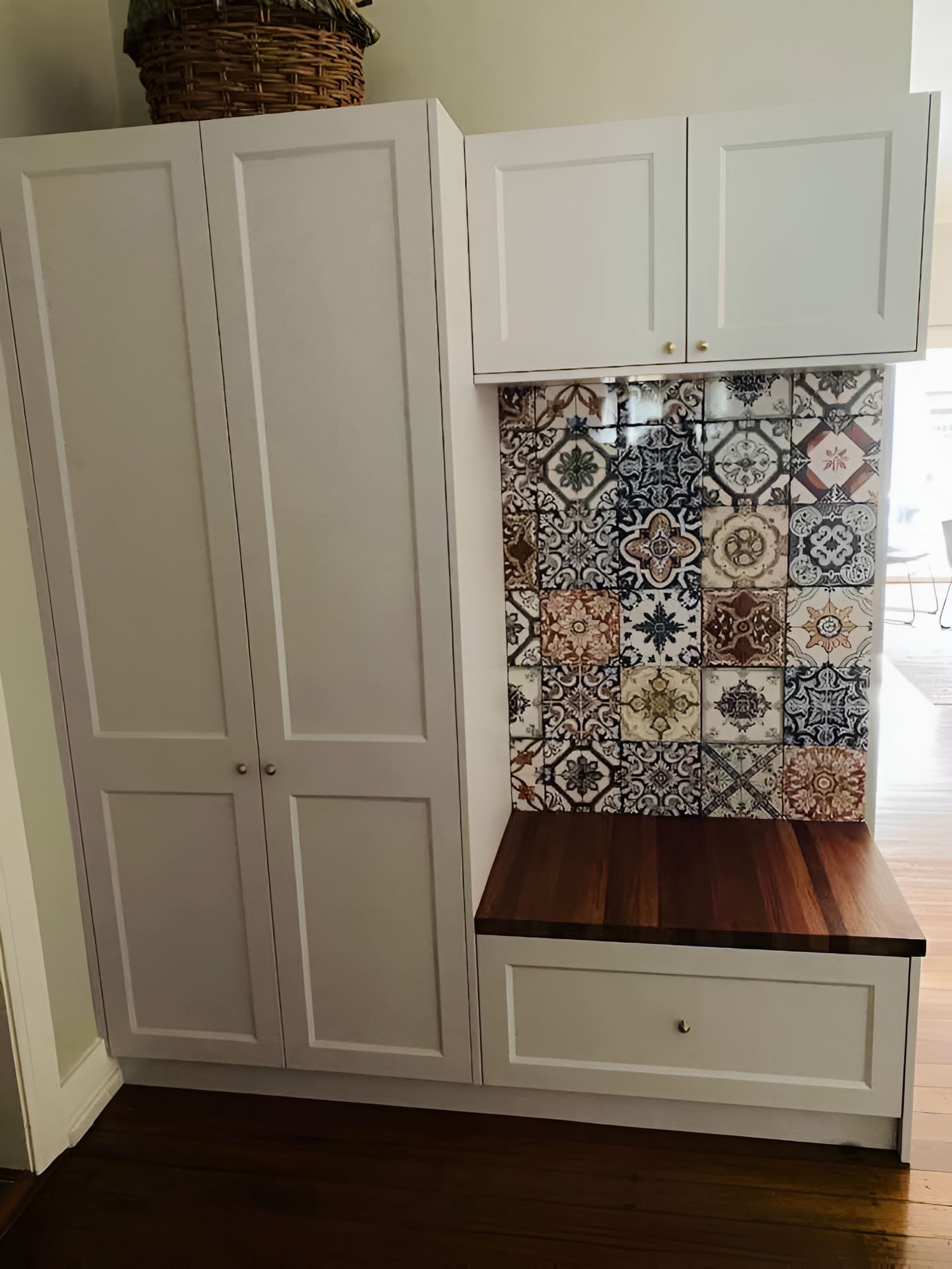A Room With White Cabinets And A Wooden Bench — Tefa Kitchens & Joinery in Rutherford, NSW