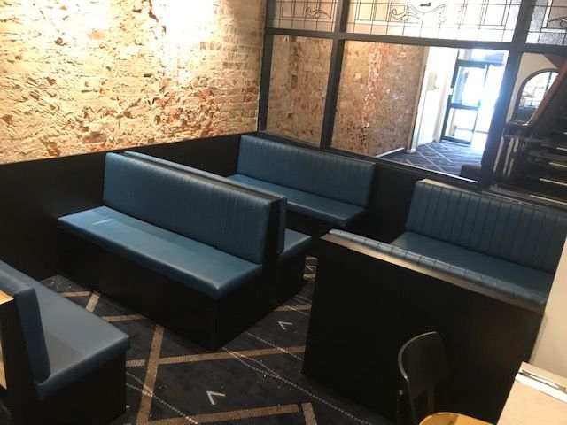 Blue Leather seats in a dining area of a restaurant — Tefa Kitchens & Joinery in Cessnock, NSW
