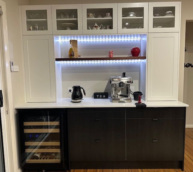 A Kitchen area with jug and coffee machine with LED lights — Tefa Kitchens & Joinery in Maitland, NSW