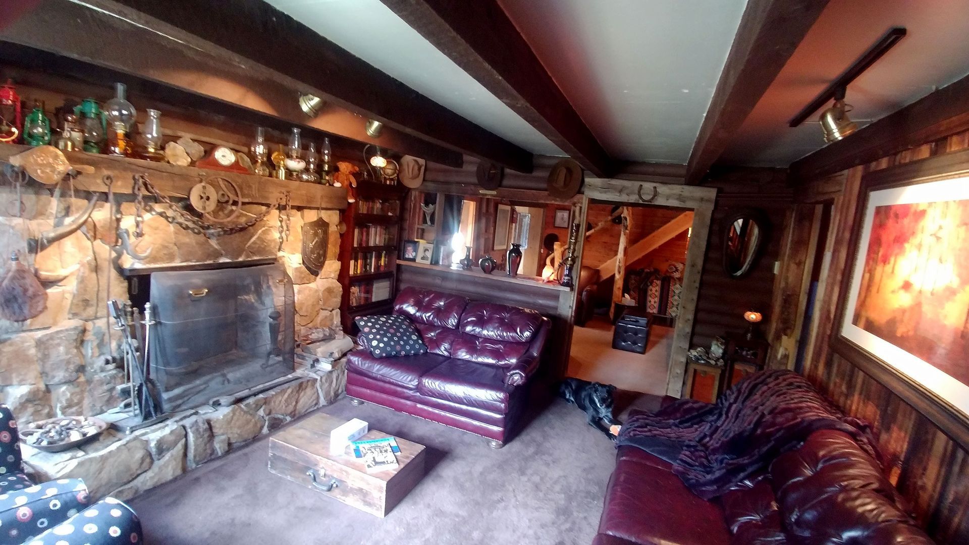 A living room with a fireplace and a couch