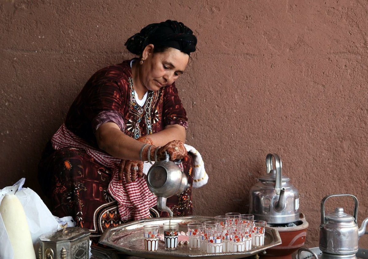 A Berber woman performs the traditional ceremony of making berber tea