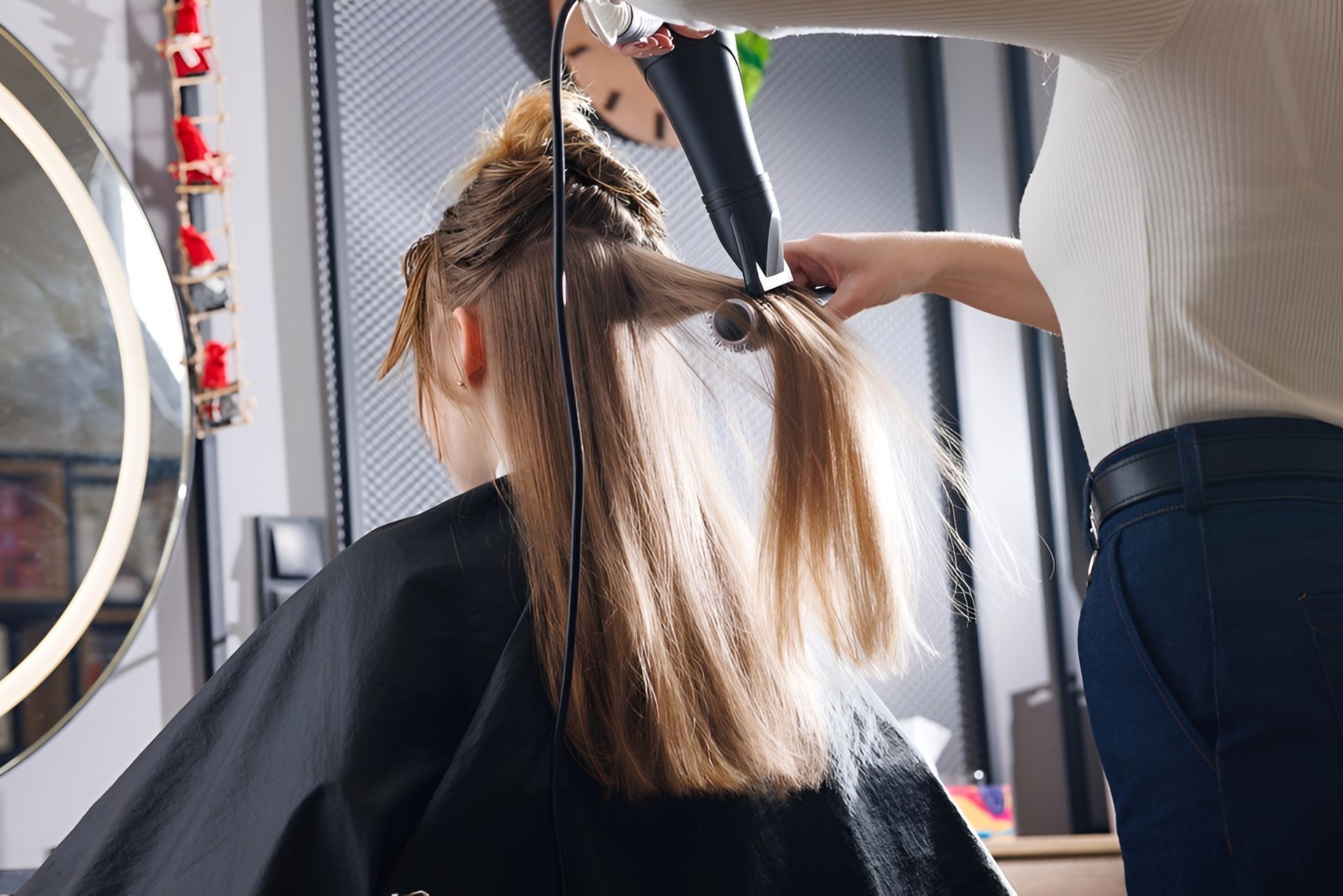 Hairdresser Blow-drying a Client's Long, Blonde Hair — 5th Ave Hair Lounge in Caloundra, QLD
