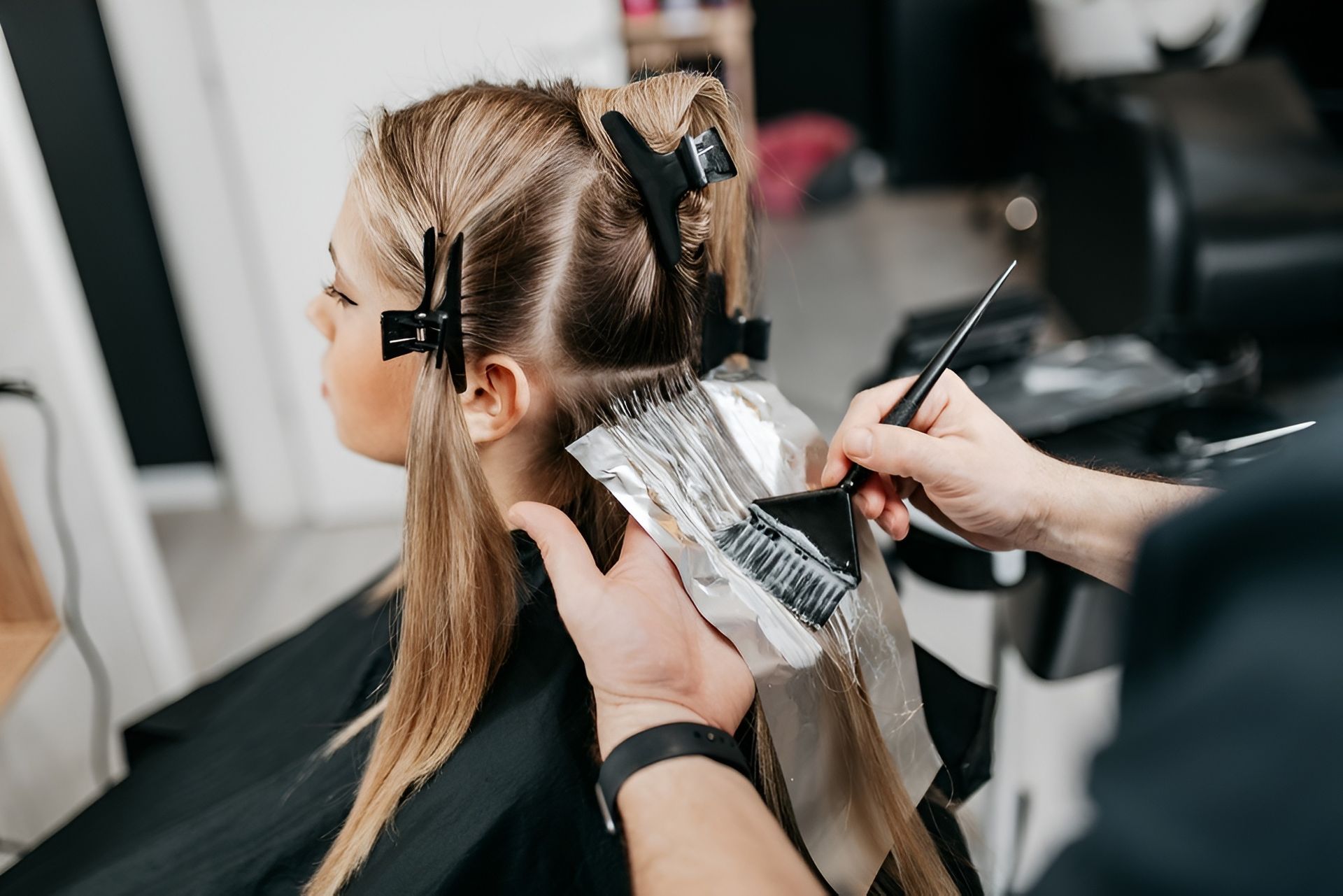 Hairdresser Highlighting Blonde Hair With Foil, in a Salon — 5th Ave Hair Lounge in Caloundra, QLD